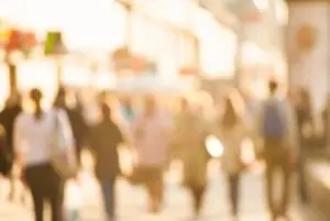 A blurry picture of people walking down the street