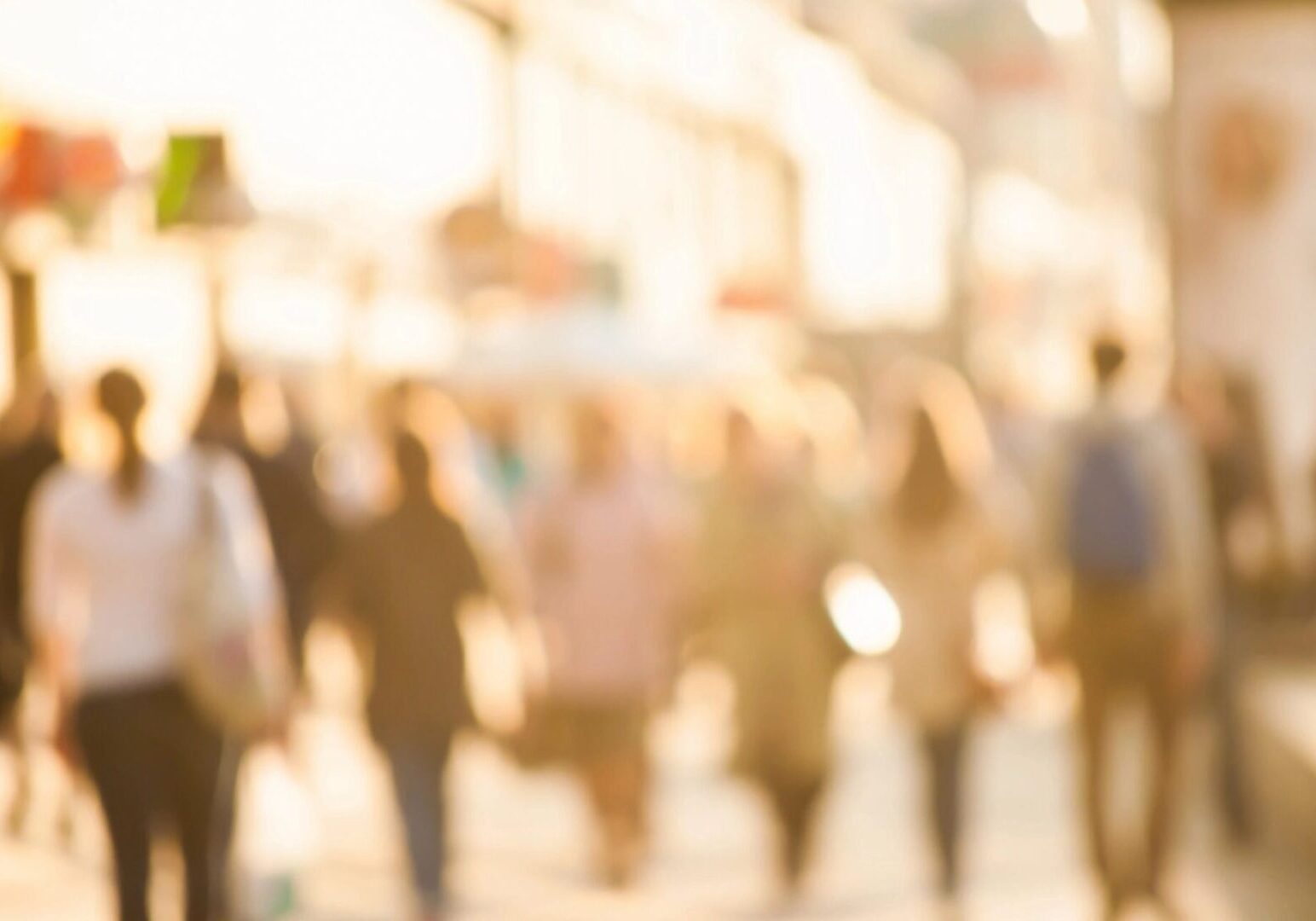 A blurry picture of people walking down the street